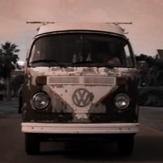 an old vw bus is parked on the street