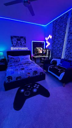 a bedroom with two beds and a video game controller