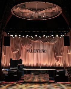 the stage is set up for a valentine's day party with lights on it