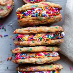 sprinkled cookies stacked on top of each other