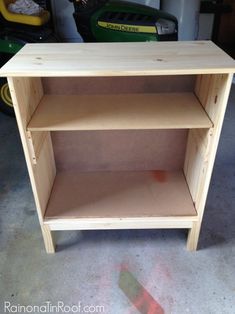 a wooden shelf sitting inside of a garage