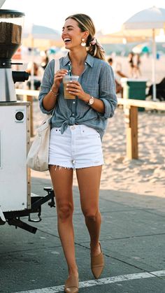 effortlessly chic summer shorts outfit  crisp white high-rise denim shorts with raw hems, paired with a slightly oversized grey button-down shirt made from airy cotton-poplin, casually tucked in front with the sleeves rolled to mid-forearm. Collared Shirt And Shorts, Paris Style Summer Outfits, Women Shorts Outfits, Beach Wear For Women Outfits Casual, Spring Beach Outfits Casual, Swimsuit With Shorts Outfit, Over 40 Fashion Summer, Spring Short Outfits, Summer Outfits Women 20s Casual