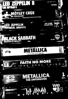 black and white photograph of metalica records stacked on top of each other with the words metallicica printed on them