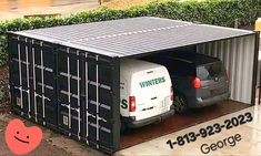 two vans are parked in the back of a shipping container that has been converted into a storage shed