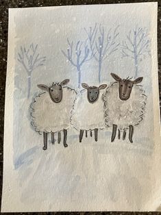 three sheep standing next to each other on a piece of paper with trees in the background