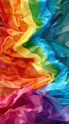 an abstract rainbow colored background with wavy lines and colors that appear to have been folded together