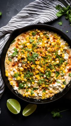 an overhead view of a skillet with corn and cilantro on the side