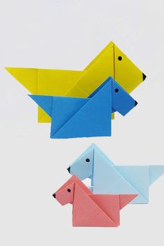 three origami animals in different colors and sizes, one is yellow, the other is blue
