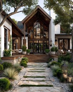 a large house with stone steps leading to it's front door and patio area