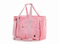 a pink tote bag sitting on top of a white table