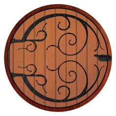 a round wooden table with wrought iron designs