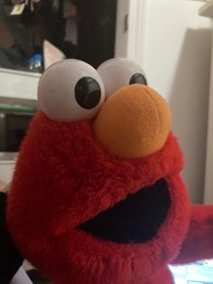 a close up of a stuffed animal on a table