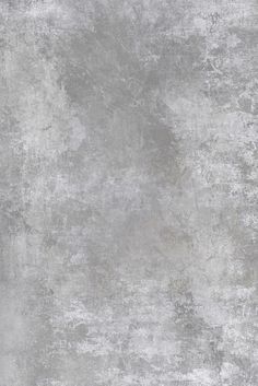 an old grungy concrete wall textured with light gray paint