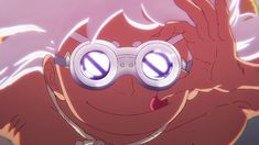 an anime character wearing goggles with her eyes wide open and tongue hanging out to the side