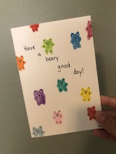 someone holding up a card with teddy bears on it that says have a beary good day