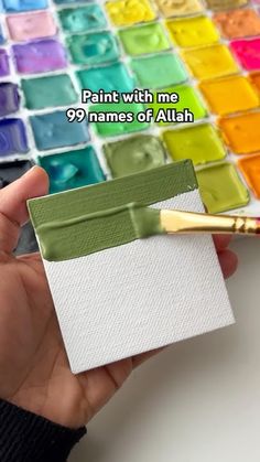 a person holding a paintbrush over some different colors of paint in their hand with the words paint with no 99 names of atlash on it