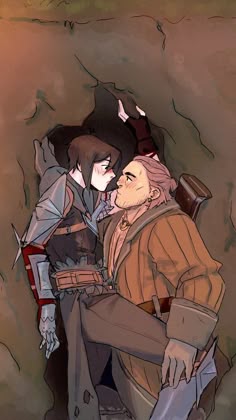 two people standing next to each other in a cave