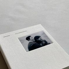 an open book with a black and white photo on it