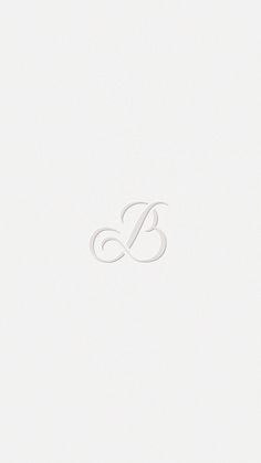 the letter b is made up of white paper and has an elegant monogramic design