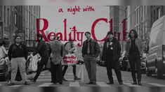 a group of people standing in the middle of a cross walk on a city street