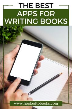 the best apps for writing books on a desk with a person holding a cell phone
