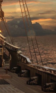the deck of a large ship at sunset