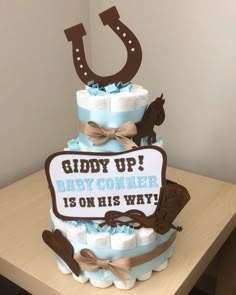 a baby shower cake with a cowboy theme