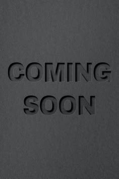 the words coming soon are made out of cutout letters on a gray background with black edges