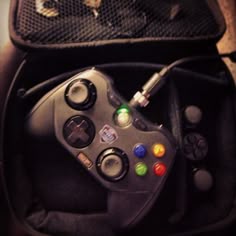 a video game controller sitting inside of a bag