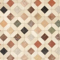a tile floor with different colors and patterns on it's sides, including black, brown