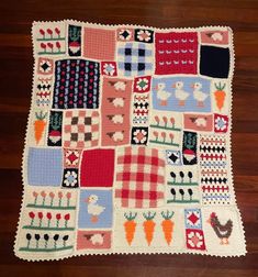 a crocheted patchwork rug with many different designs on it