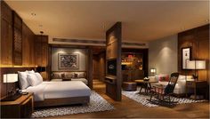 a bedroom with a bed, desk and chair in it's center area is shown