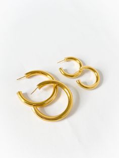 Everyone needs one of these, pairs well with everything and anything. Comes in gold and silver, and in two sizes. Made in Gold Vermeil (18k gold layer on sterling silver) & Sterling Silver Dimensions: small 5mm wide, 22mm inner diameter / large 7mm wide, 45mm inner diameter Gold Plated Hoops, Classic Everyday Gold Plated Hoop Earrings, Classic Gold Plated Hoop Earrings, Handmade Classic Gold Hoop Earrings, Everyday Gold Hoop Earrings With Plating, Medium Gold Hoops, Medium Gold Hoop Earrings, Classic Gold Plated Pierced Hoop Earrings, Classic Gold Hoop Earrings