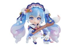 an anime figurine is holding a stick and wearing a blue outfit with flowers on it