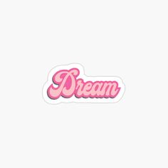 a pink sticker with the word dream on it