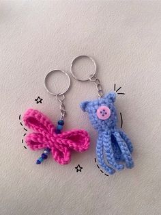 two crocheted keychains that have been made to look like animals