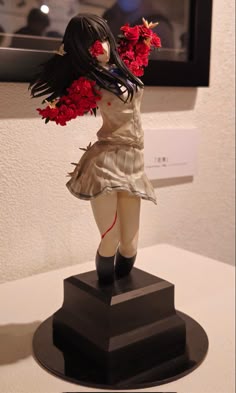 a statue of a woman with flowers in her hair