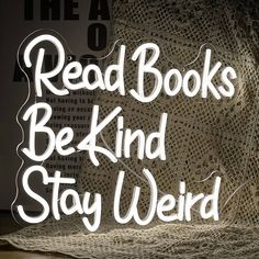 the words read books, be kind stay weird written in white