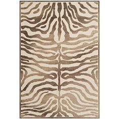 a brown and white rug with zebra print