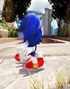 the sonic character is riding on top of a skateboard in front of some trees