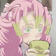 an anime character with pink hair drinking from a green cup and looking at the camera