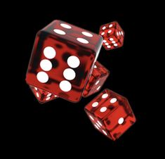 three red dices with white dots on them are flying through the air in front of a black background