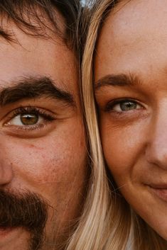 a close up of two people smiling for the camera