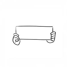 a hand holding up a sign with one thumb on it