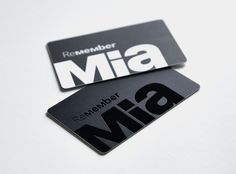 two black and white business cards with the word mia on them are laying next to each other