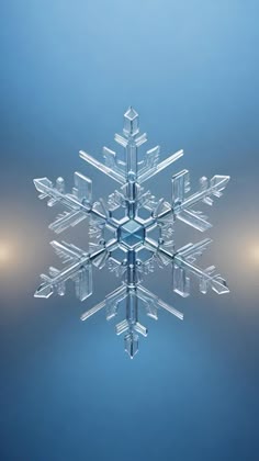 a snowflake is shown in the middle of blue and gray background with light reflections