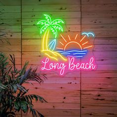 a neon sign that says long beach with a palm tree and sun in the background
