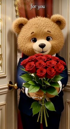 a teddy bear holding a bouquet of red roses in front of a door with the words i love you on it
