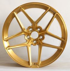 a gold wheel on a white background