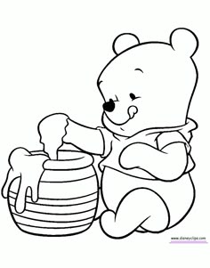 a winnie the pooh bear sitting next to a honey pot and holding a teddy bear